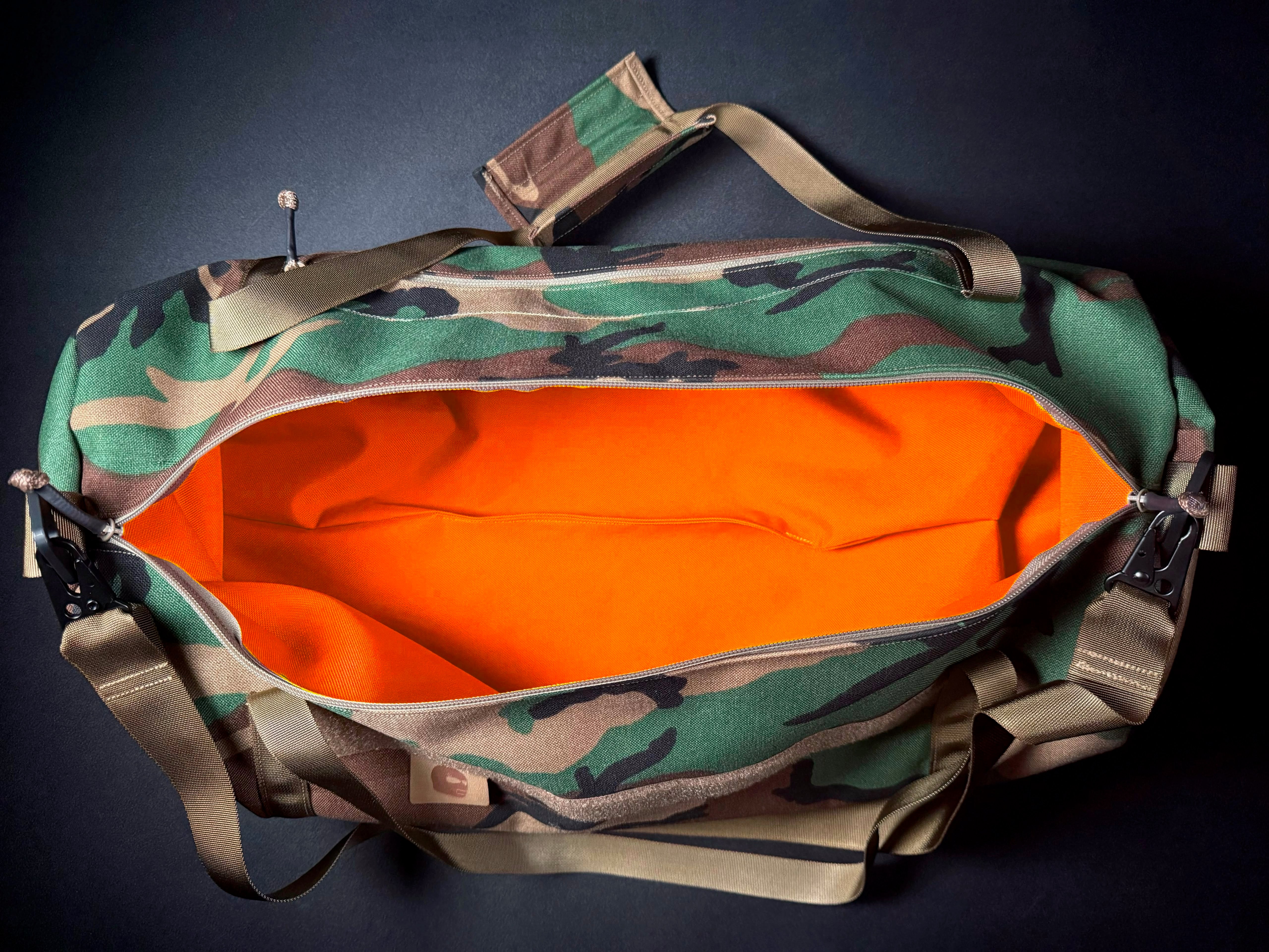 M81 (WOODLAND) DUFFLE W/ HUNTER ORANGE INTERIOR DEADLY CUSTOMS
